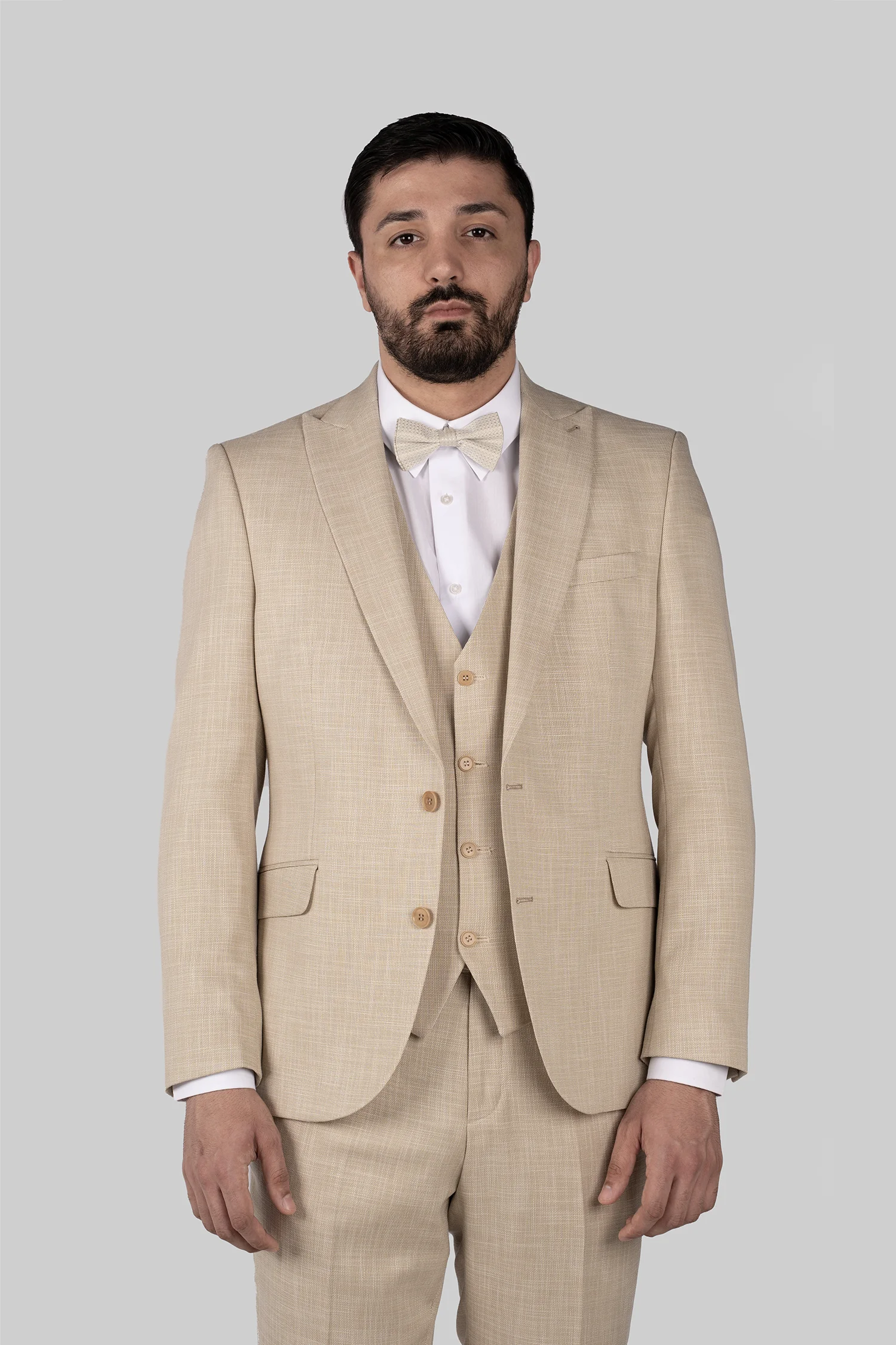 Beige three-piece suit with tailored fit