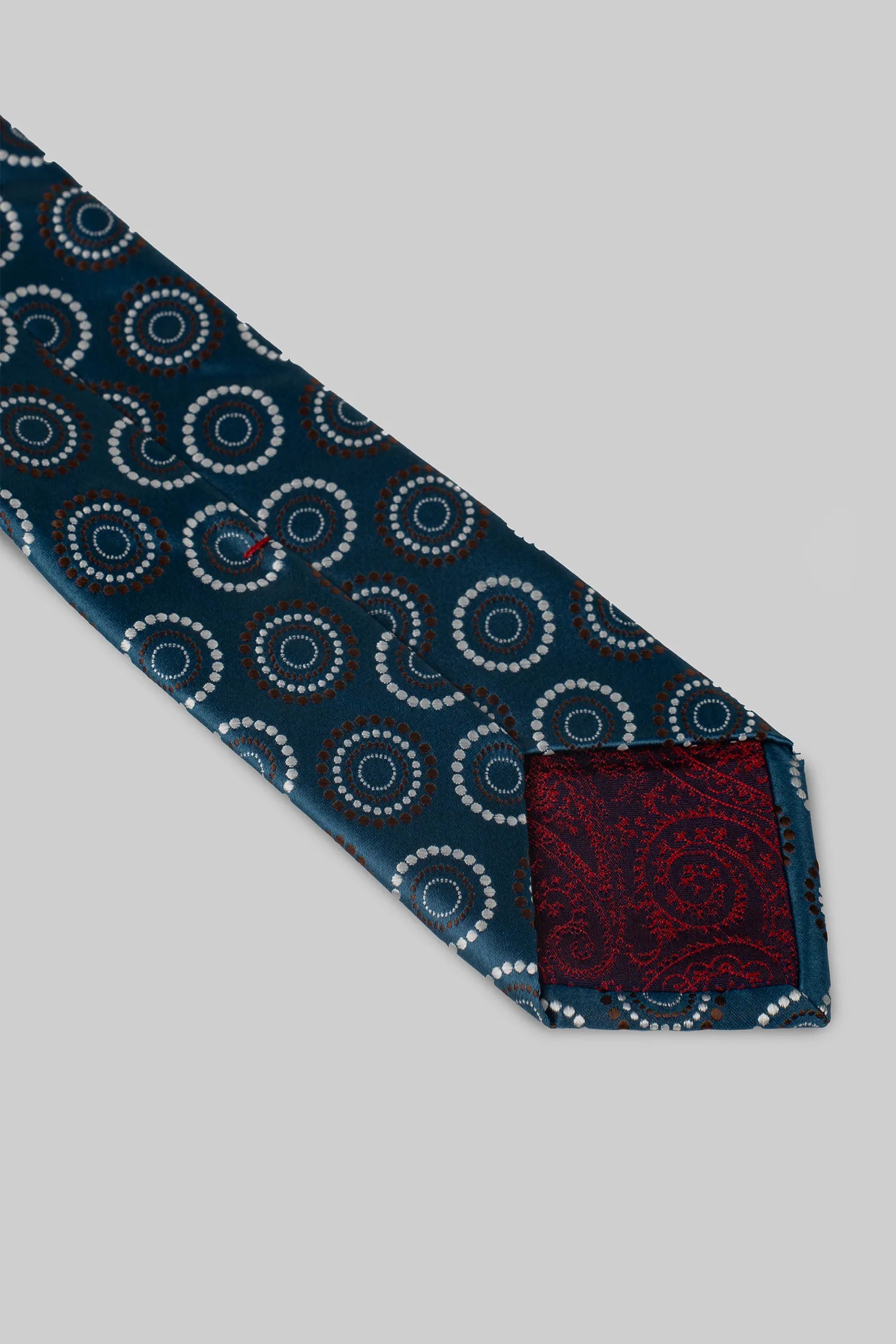 Turquoise tie with circular pattern and microfiber pocket square