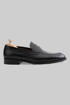 Schwarzer Penny Loafer aus geprägtem Kroko-Leder