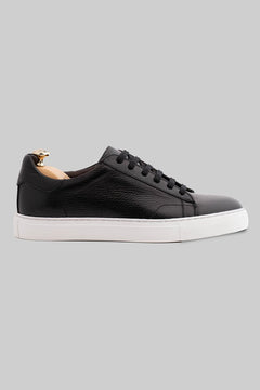 Black sneaker made of deerskin