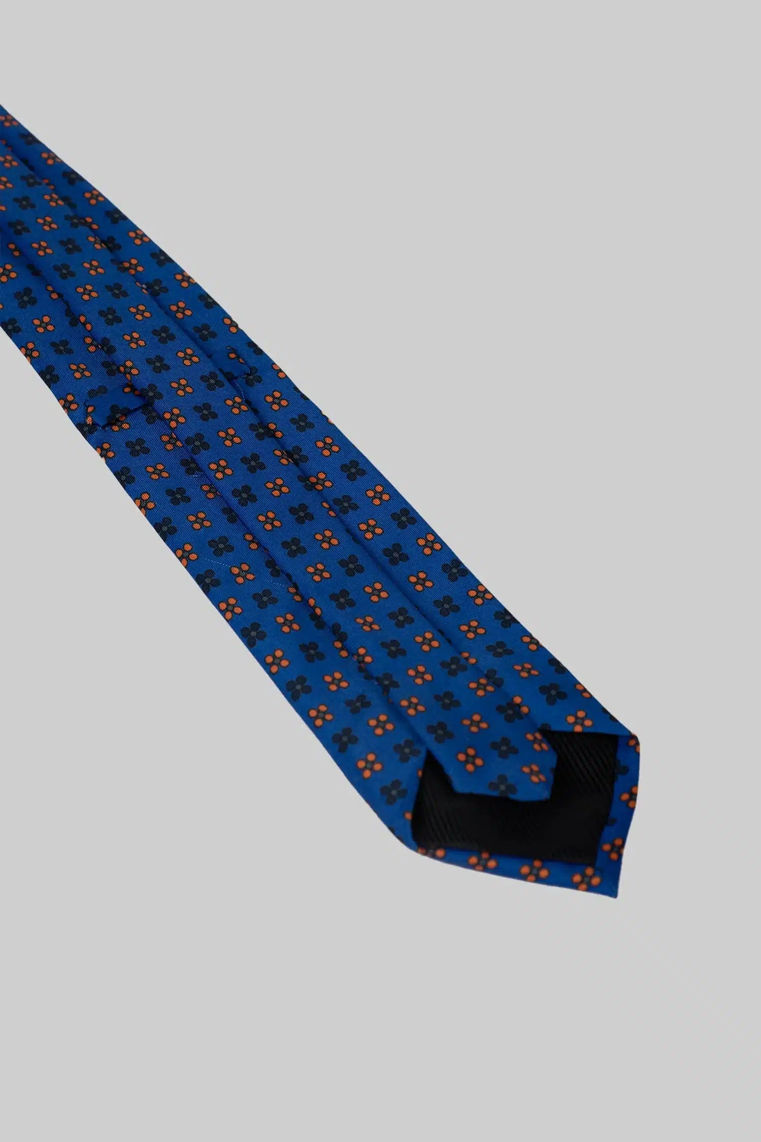 Blue tie and pocket square with floral polka dot pattern made of microfiber