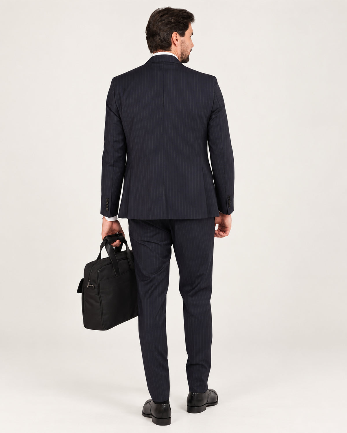 Navy pinstripe slim-fit three-piece wool suit