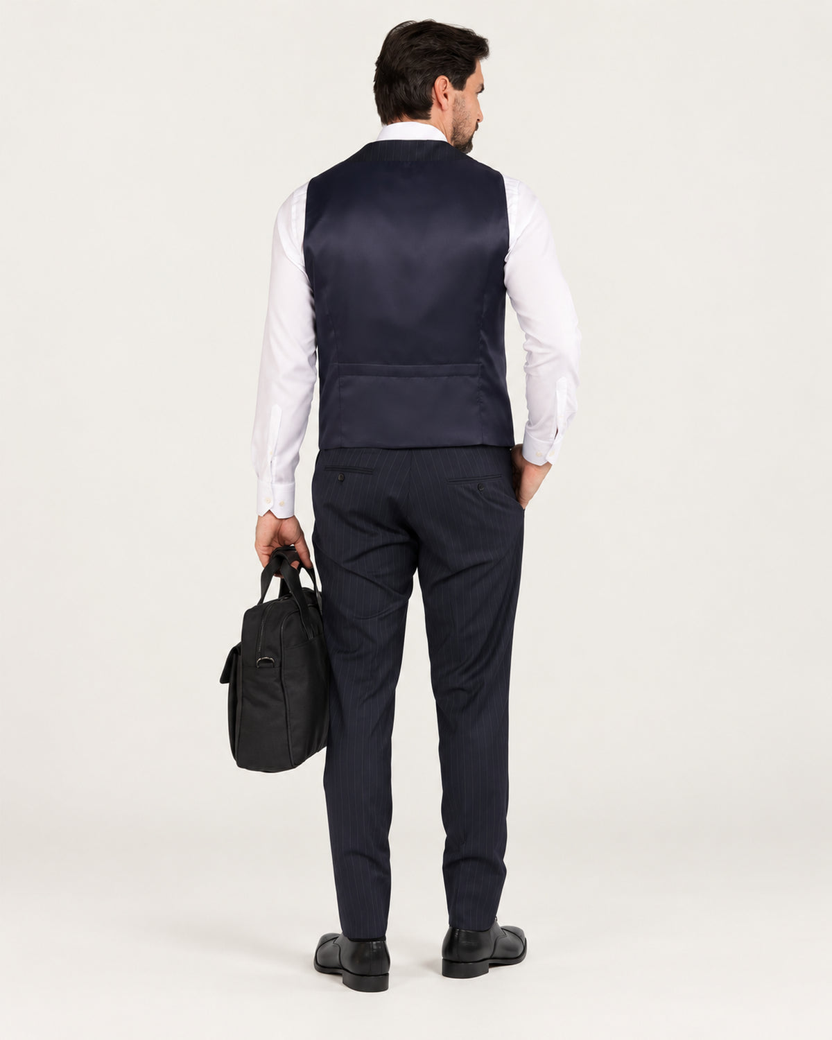Navy pinstripe slim-fit three-piece wool suit