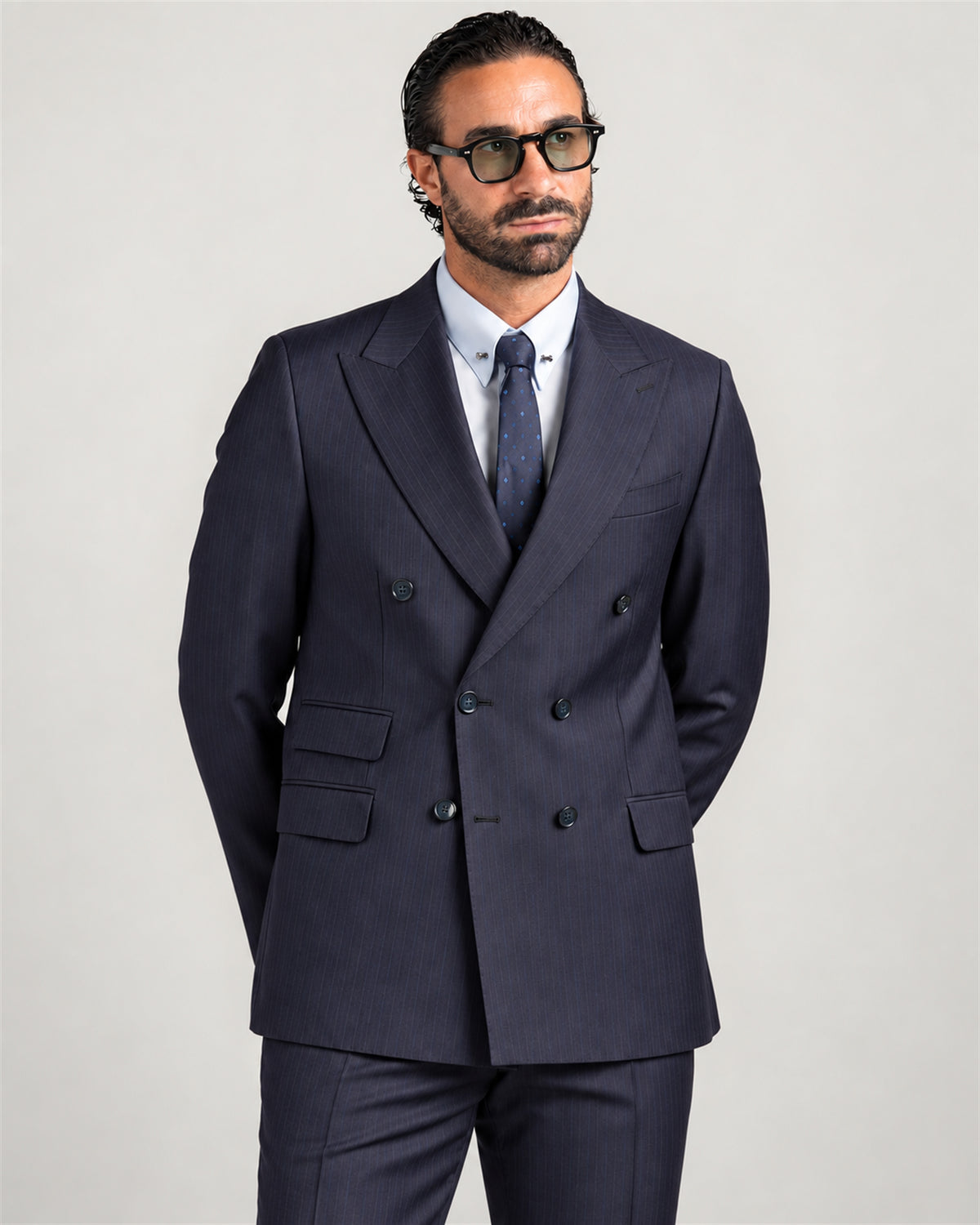 Navy slim-fit pinstripe double-breasted wool suit – on model