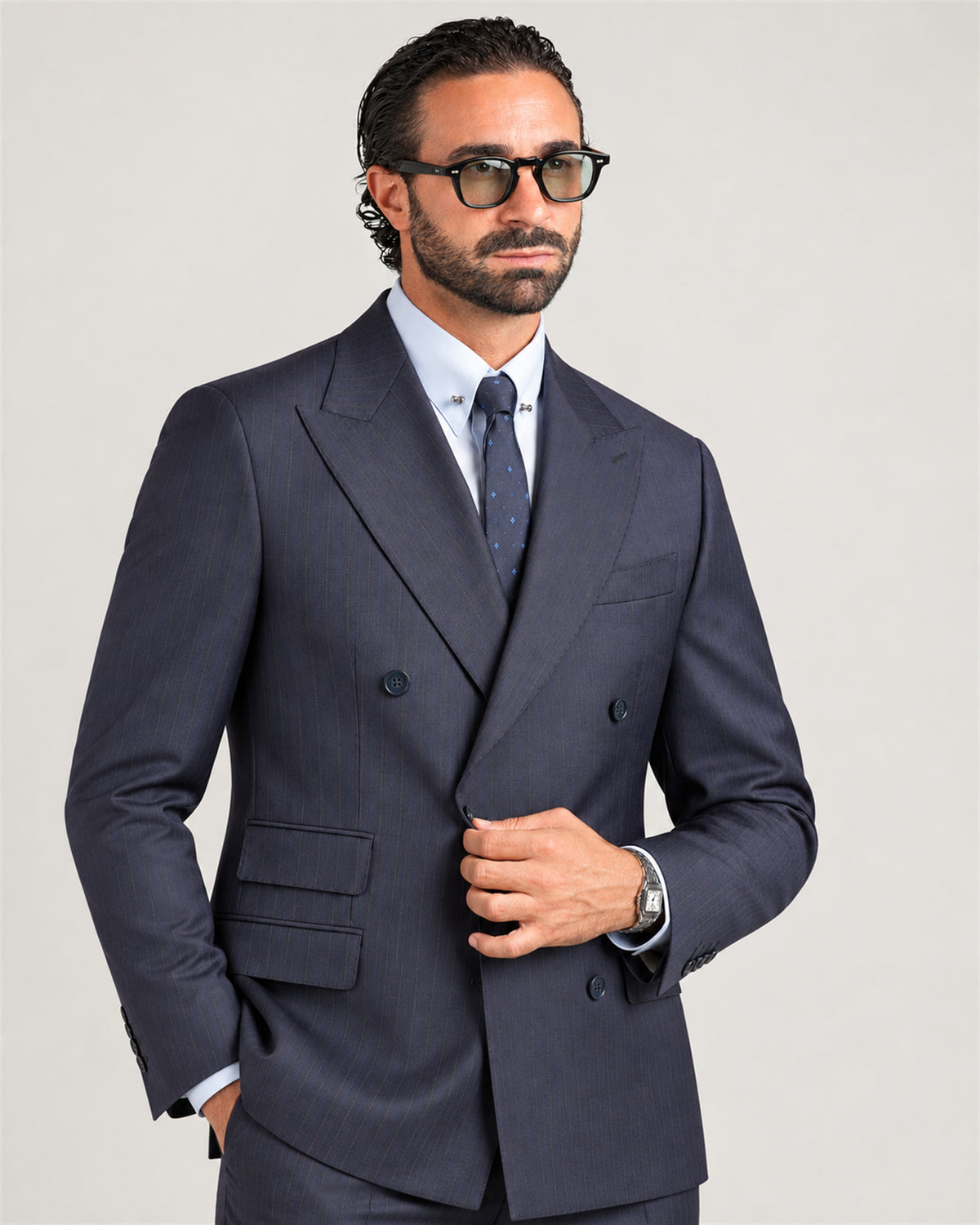 Navy slim-fit pinstripe double-breasted wool suit – on model