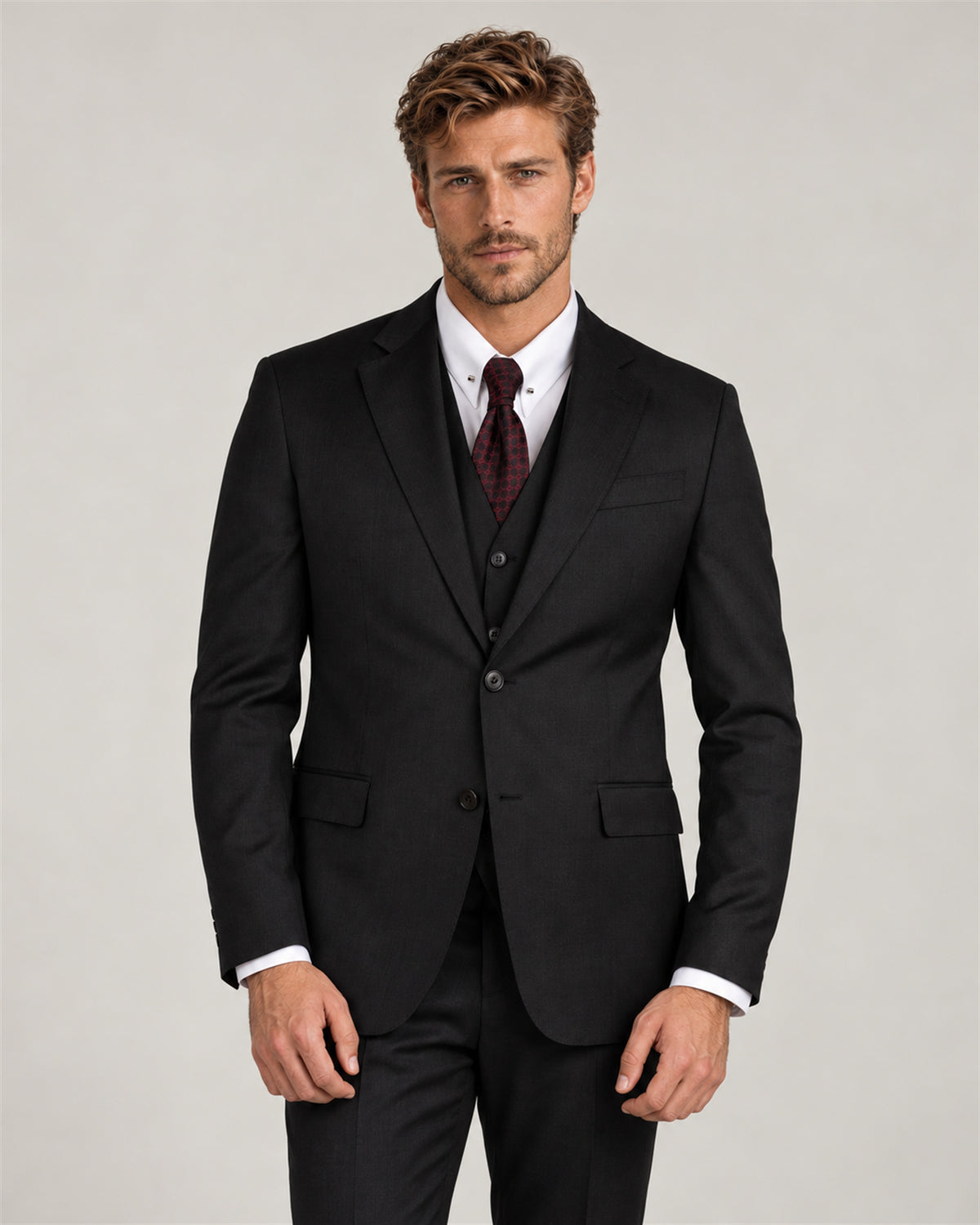 Dark grey tailored-fit three-piece wool suit – on model