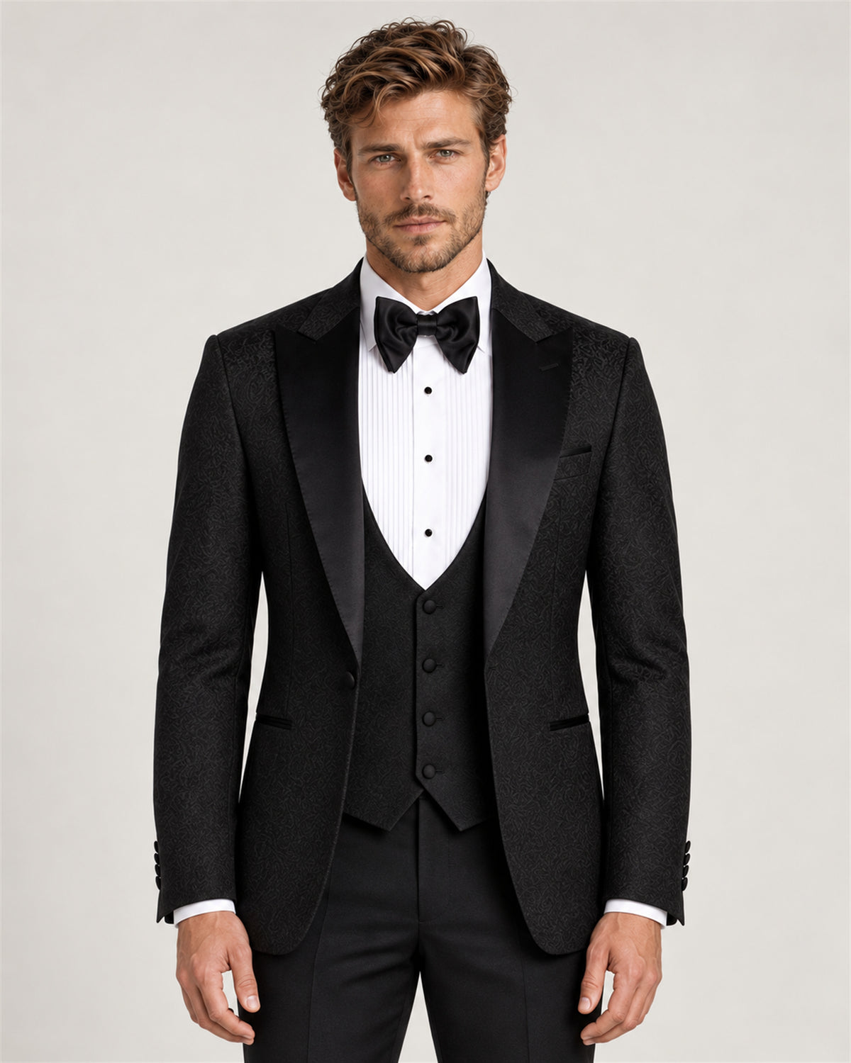 Black three-piece slim-fit tuxedo with a shawl collar – on model