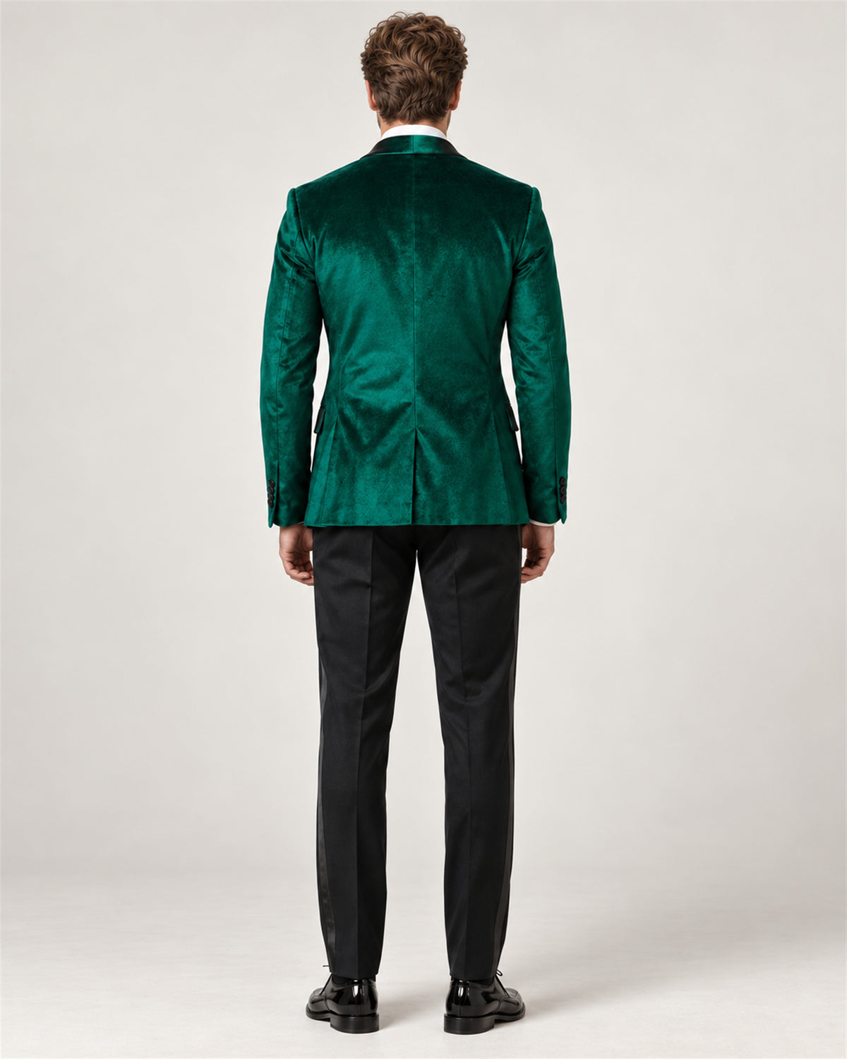 Emerald green slim-fit tuxedo with a velvet jacket – back view on model