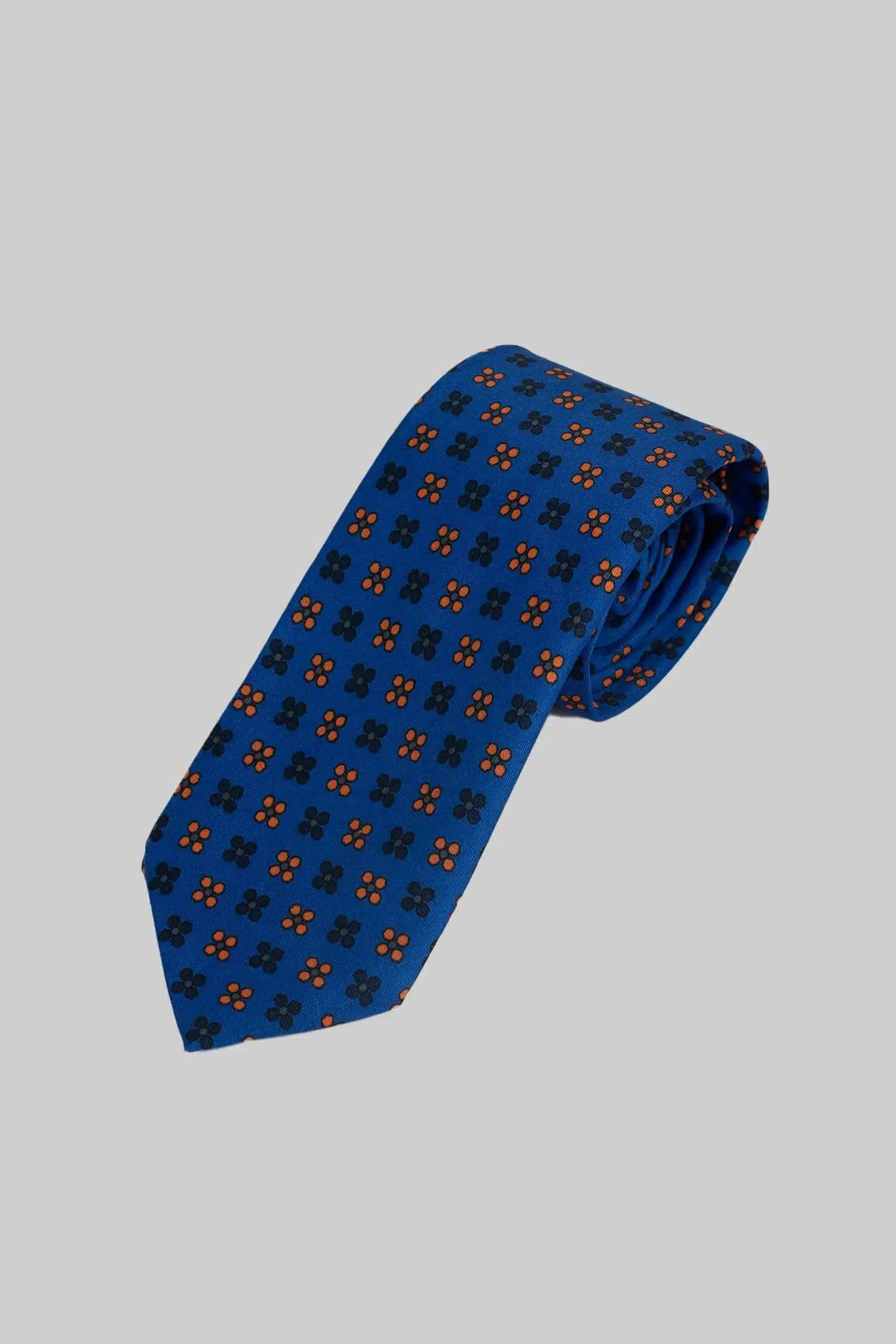 Blue tie and pocket square with floral polka dot pattern made of microfiber