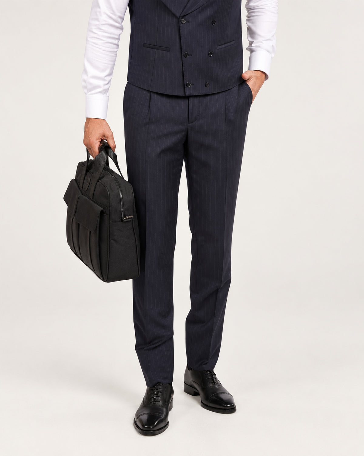Navy pinstripe slim-fit three-piece wool suit