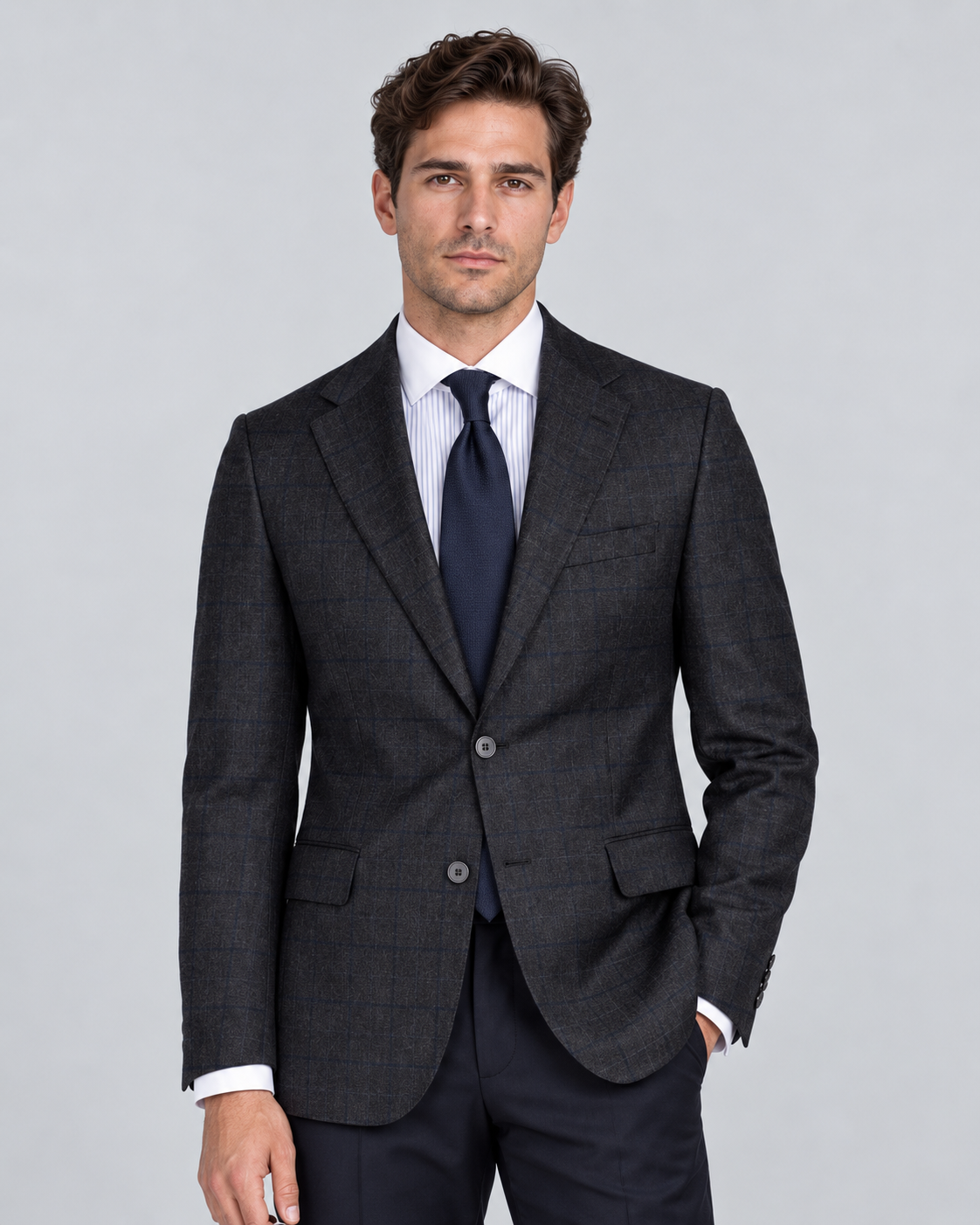 A dark grey, single-breasted checked suit – classic. Understated. Elegant.