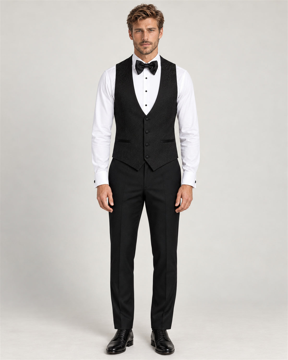 Black three-piece slim-fit tuxedo with a shawl collar – waistcoat and trousers on model