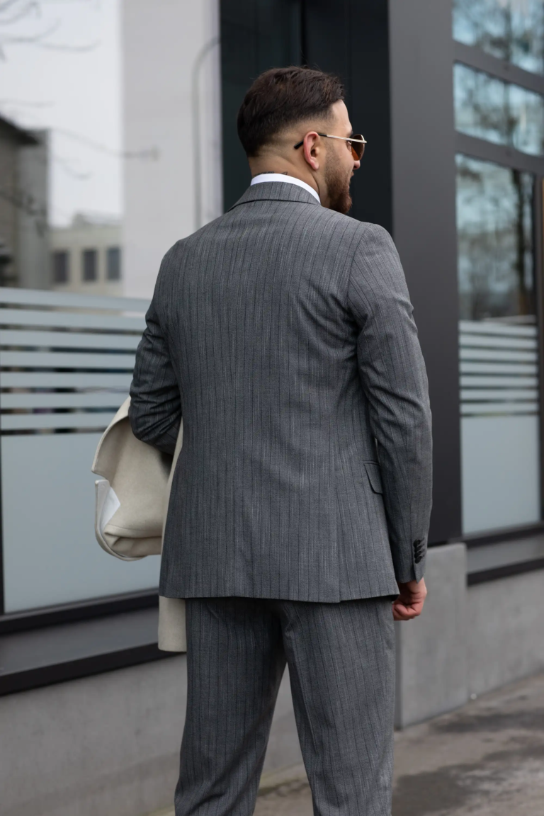 Three-piece gray suit with pinstripes